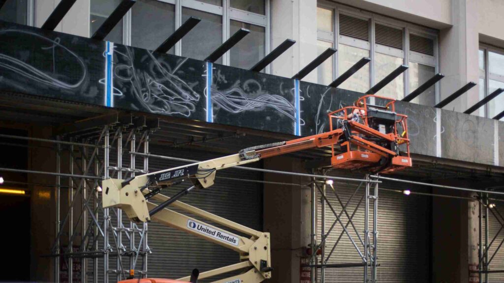 Installation of artwork on scaffolding for 7 on 16th